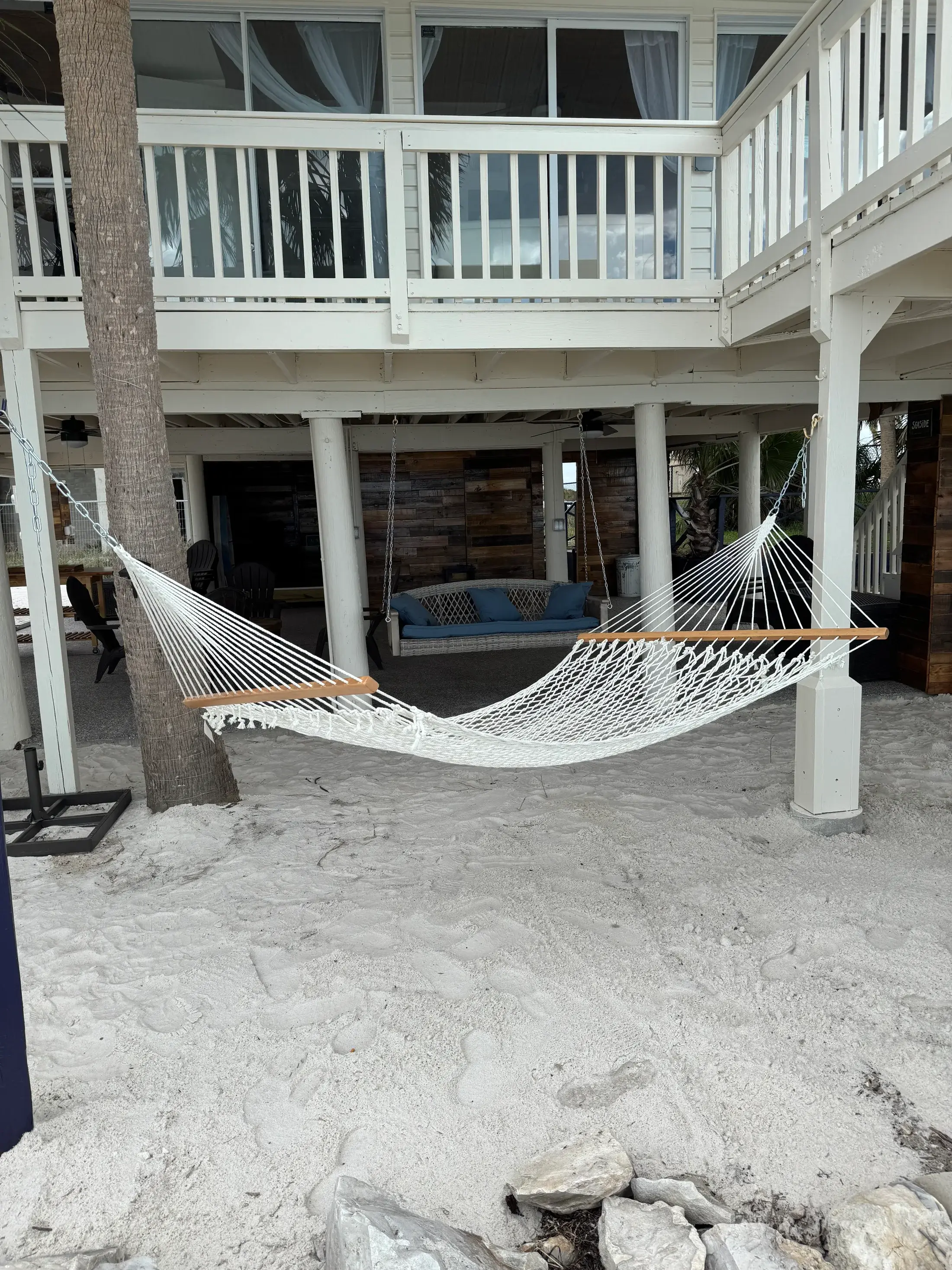 Hammock beneath the stilt house near the private beach area.
